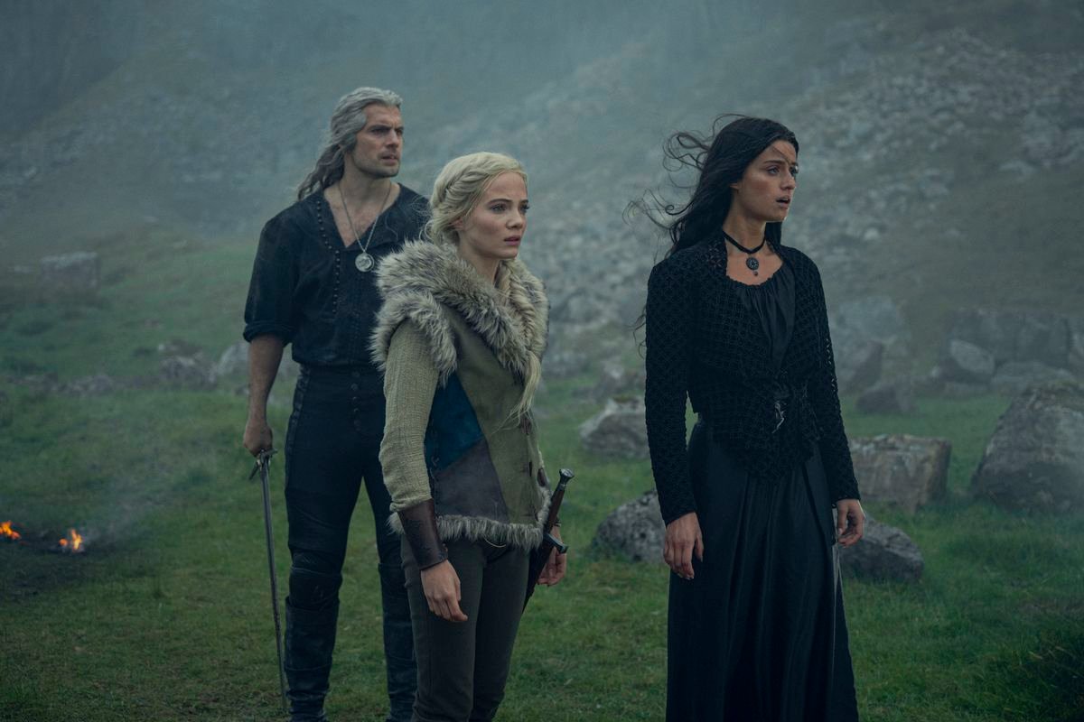 Geralt, Ciri and Yennefer stand in a rocky field in season 3 of The Witcher