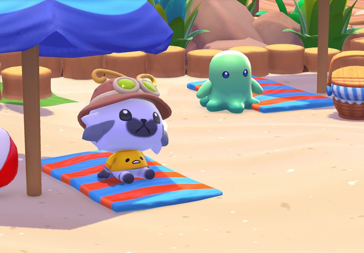 An image of a customized character sitting on a beach in Hello Kitty Island Adventure. It looks like a cartoony cat with a big head and it has black and white markings on its face.