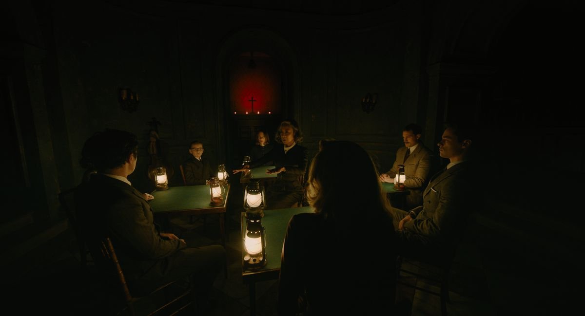 A group of people perform a seance