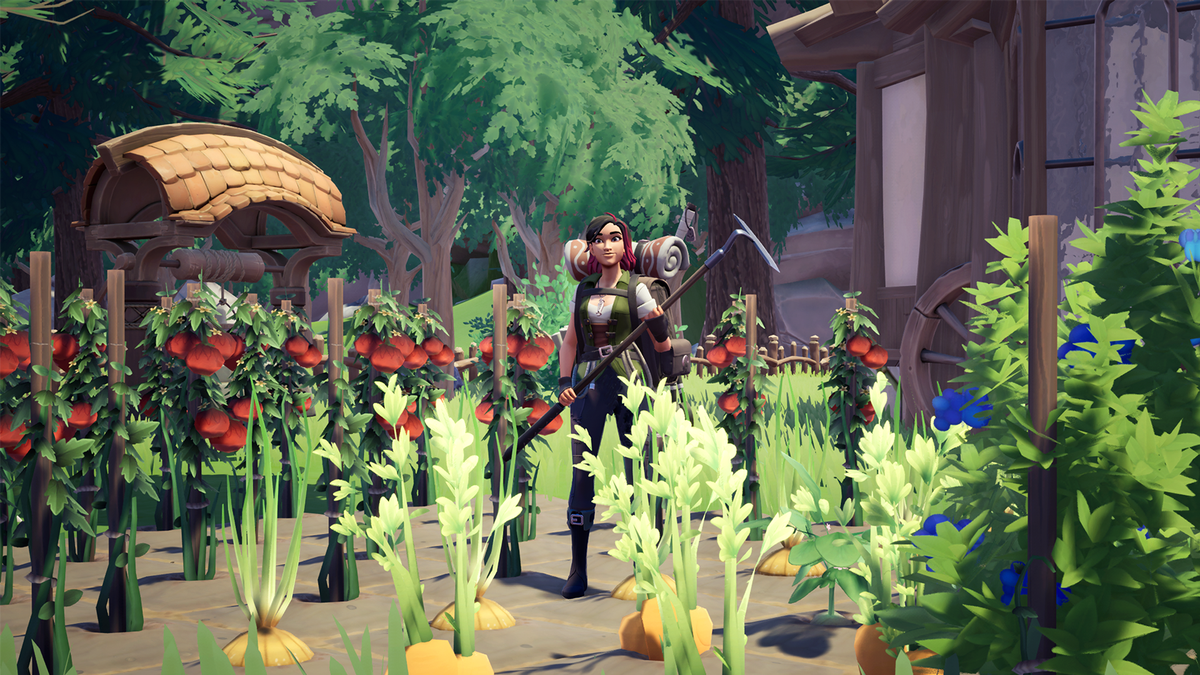 A character in Palia stands in the middle of their full garden, holding a hoe.