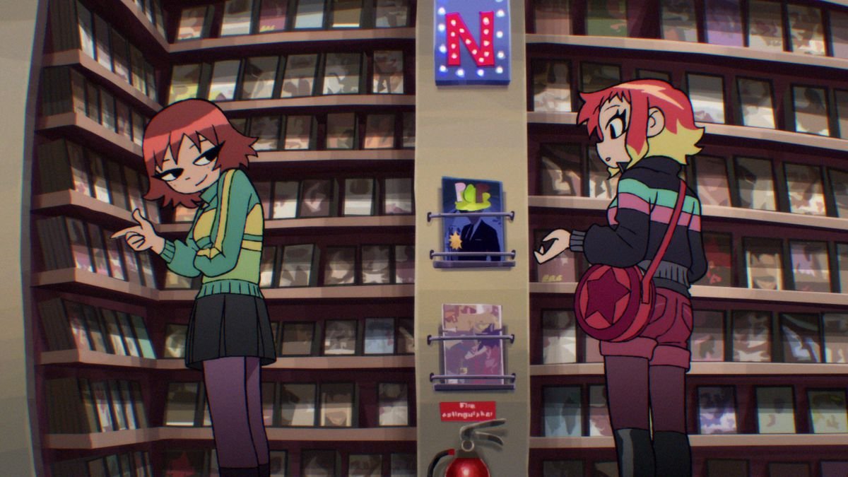 Kim and Ramona talking in a video store