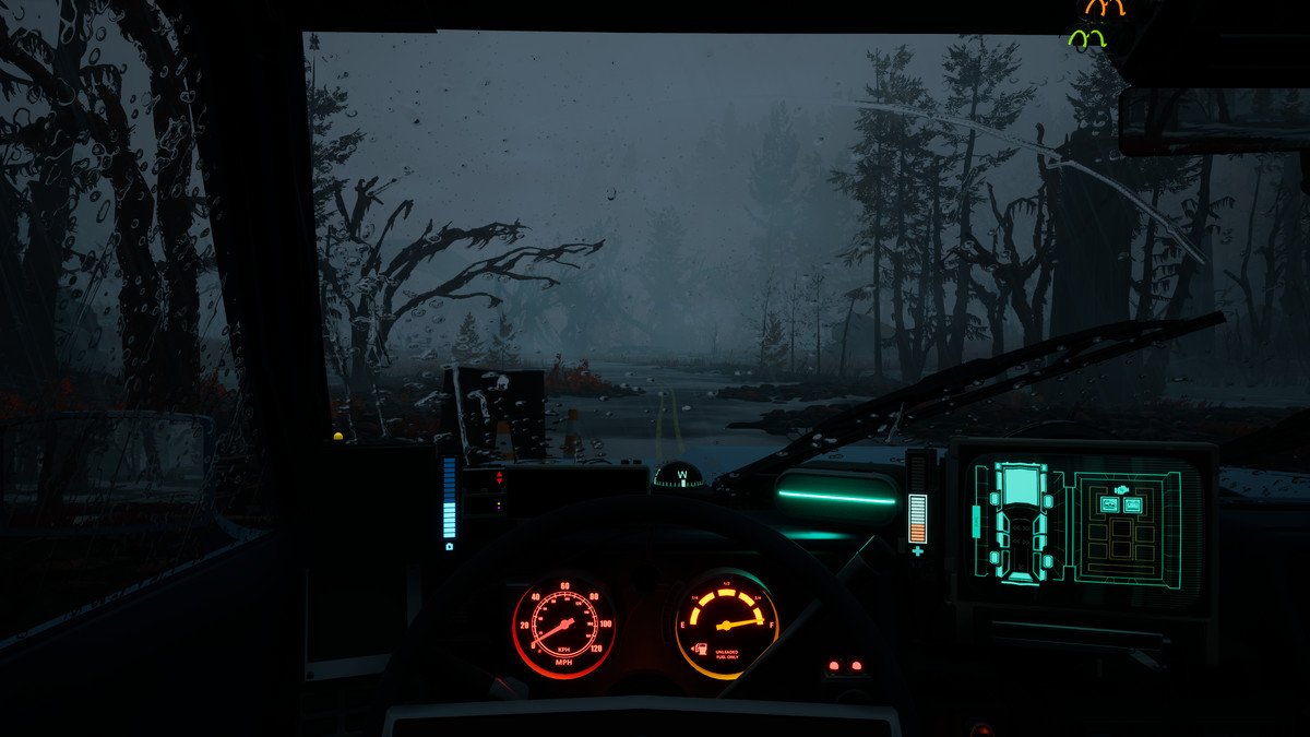 A view through a dark, rainy car windshield at dusk, with trees receding in dim fog. The car’s instruments glow